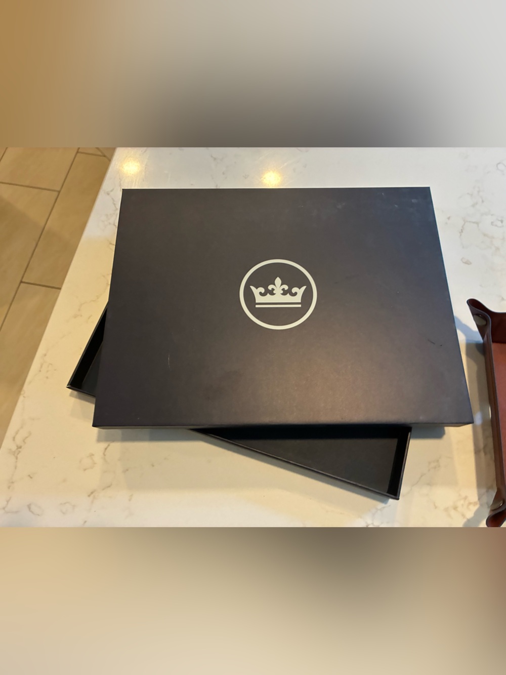 Peter Millar wireless charging catch and wireless headphones